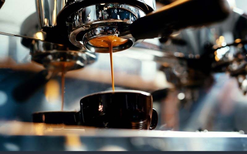 stock-photo-close-up-of-espresso-pouring-from-coffee-machine-professional-coffee-brewing-278456510-800x500